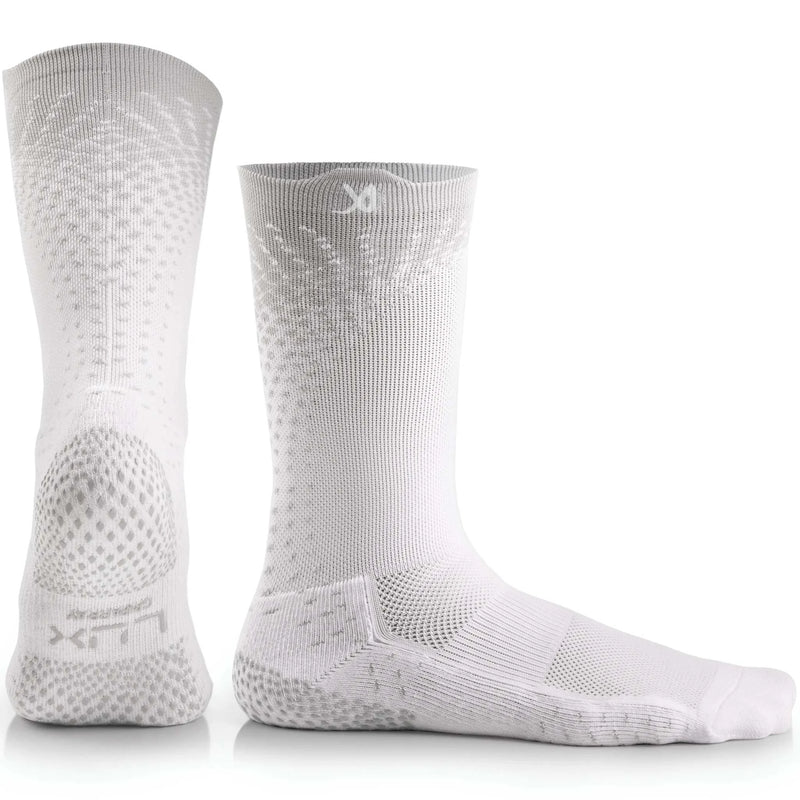 White LUX performance grip cleat socks with advanced traction technology for soccer.