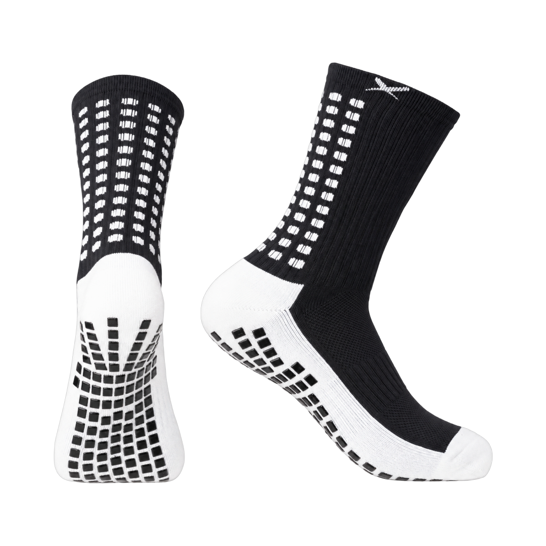 LUX V1 junior football grip socks in black, pair shown front and side